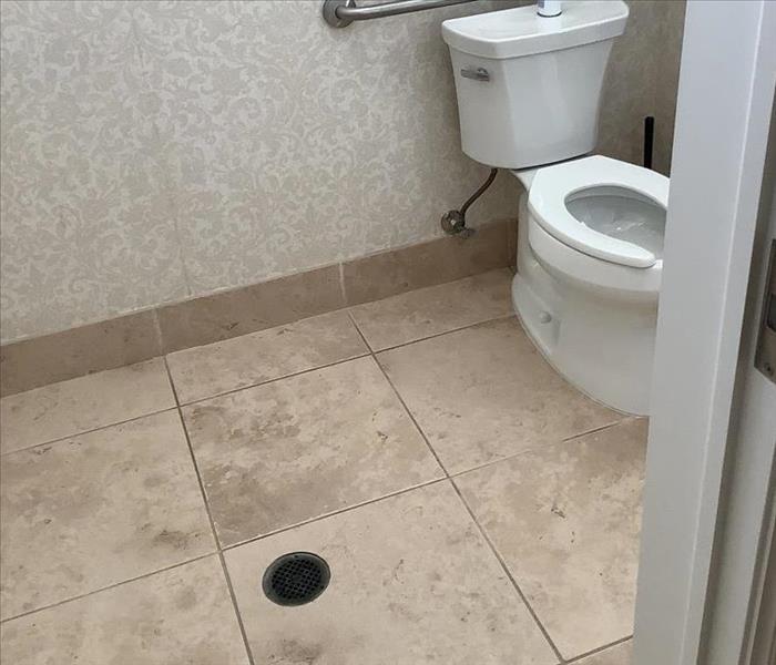 Commercial bathroom with tile floor