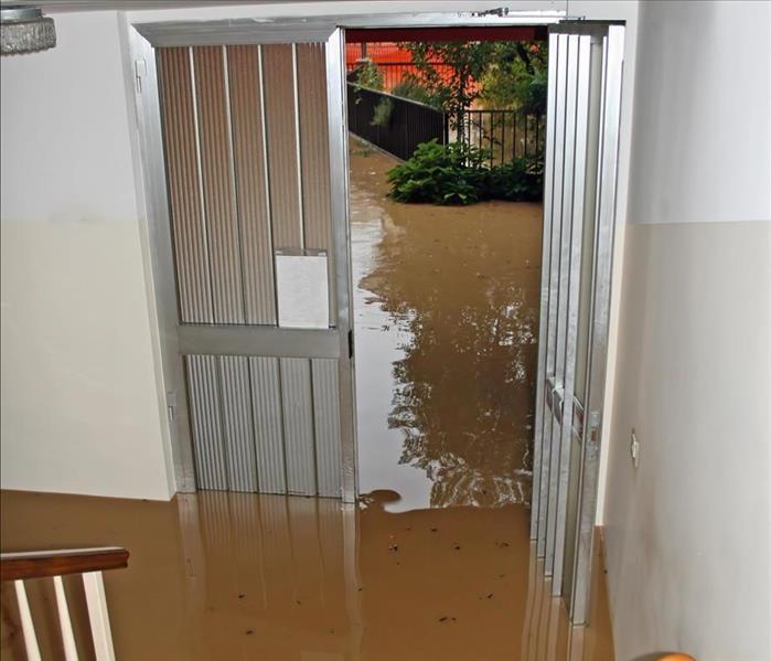Flood water in a home level of water reaches the stairs